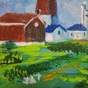 May include: A painting of a small town with a red barn, a white church, and a blue sky. The buildings are surrounded by green grass and trees.