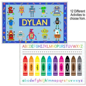 May include: A blue and white robot-themed placemat with the name "DYLAN" in yellow letters. The placemat features colorful robot illustrations and the text "12 Different Activities to choose from."