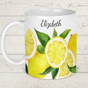 May include: White ceramic mug with a lemon design and the name "Elizabeth" printed on the front.