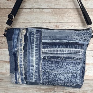 May include: A white ceramic mug with a black handle and the text "But First, Coffee" in a handwritten style. The mug is on a white surface. The mug is approximately 4 inches tall.