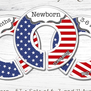 May include: Handmade nursery organizers with a patriotic theme. The set includes three circular dividers with the text "0-3 Months", "Newborn", and "3-6 Months". Each divider features a red and white striped design and a blue field of white stars.