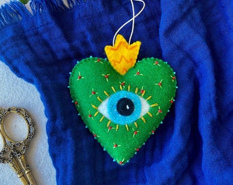 Green Sacred Heart ornament with evil eye. Handmade felt heart