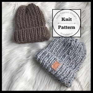 May include: Two knitted hats, one brown and one gray, with a leather patch on the gray hat. The hats are on a white fluffy surface. The image includes the text "Indie Fiberart Designs Knit Pattern #indieFiberart".