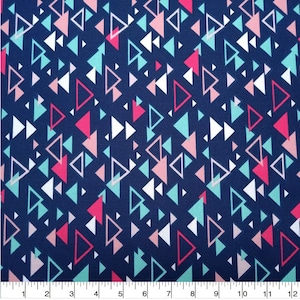May include: A navy blue fabric with a repeating pattern of pink, white, and teal triangles. The fabric is perfect for quilting, crafts, and home decor projects.