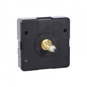 May include: Black clock movement with a gold-colored winding stem.