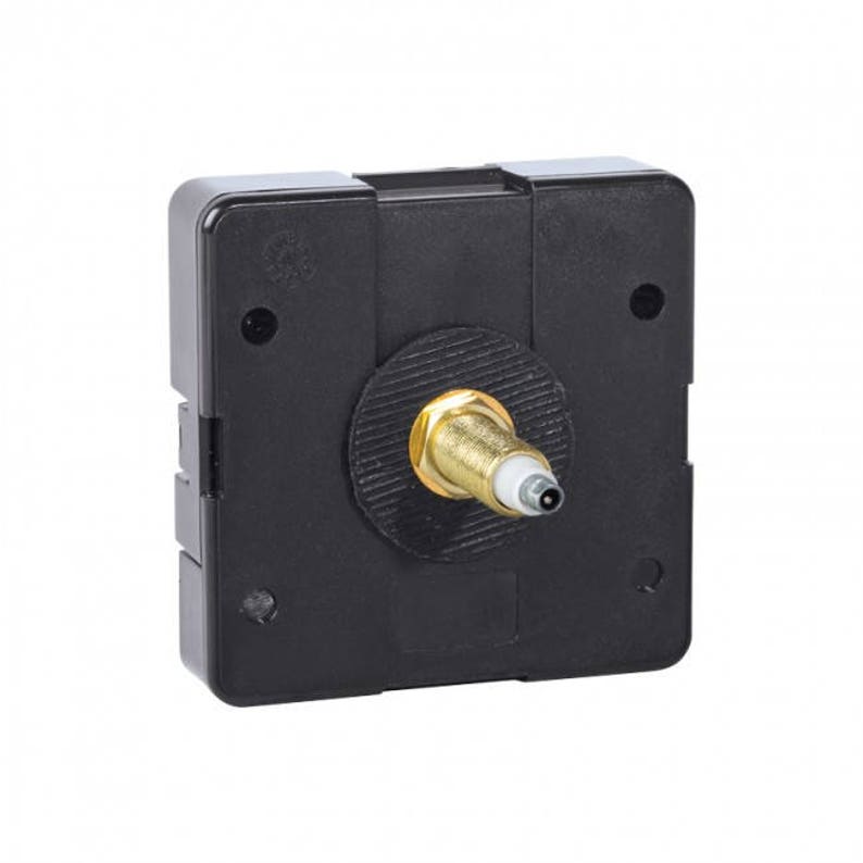 May include: Black clock movement with a gold-colored winding stem.