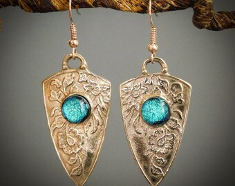 Shield Shaped Earrings Made of Art Nouveau Floral Patterned Yellow Jewelry Grade Bronze with a Blue/Green Dichroic Fused Glass Jewel