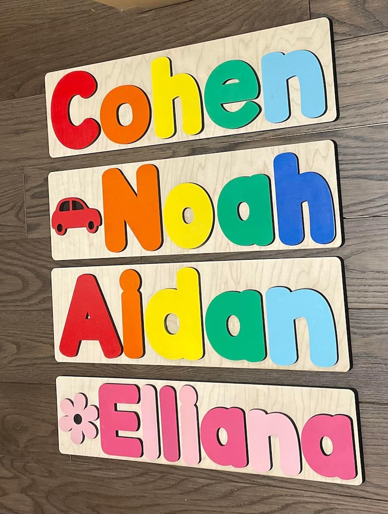 May include: Four wooden name puzzles with colorful letters. The names are Cohen, Noah, Aidan, and Elliana. The puzzles are perfect for children to learn their names and practice their fine motor skills.