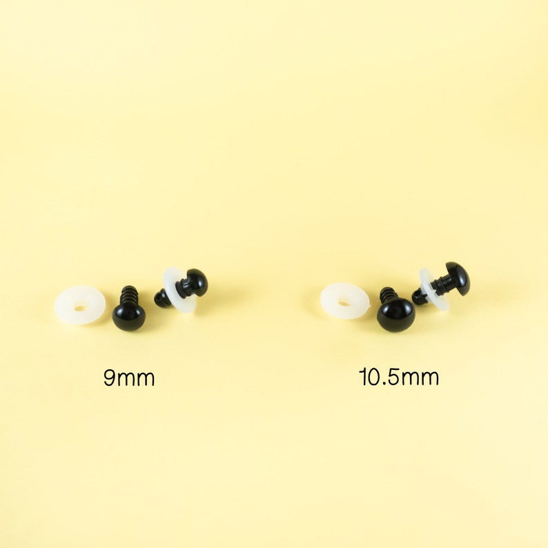 May include: Two sets of black plastic safety eyes for crafts. The set on the left is 9mm in diameter and the set on the right is 10.5mm in diameter. Each set includes two eyes and two white plastic washers.