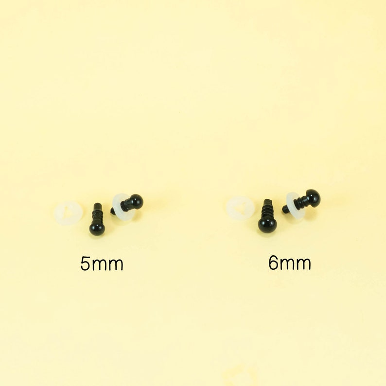 May include: Two sets of black plastic safety eyes with white plastic washers. The eyes are 5mm and 6mm in diameter.