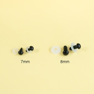 May include: Two sets of black plastic safety eyes with washers. The eyes are 7mm and 8mm in diameter.