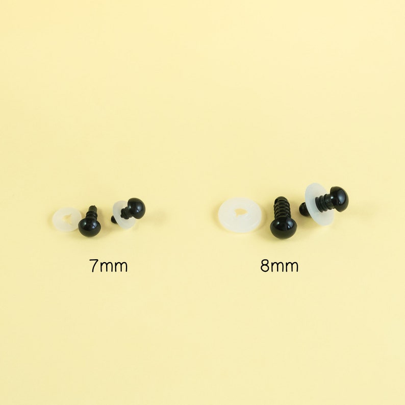 May include: Two sets of black plastic safety eyes with washers. The eyes are 7mm and 8mm in diameter.