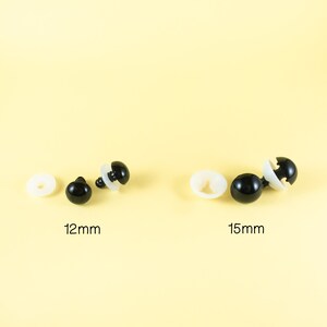 May include: Two sets of black plastic safety eyes for stuffed animals. The set on the left is 12mm in diameter and the set on the right is 15mm in diameter.