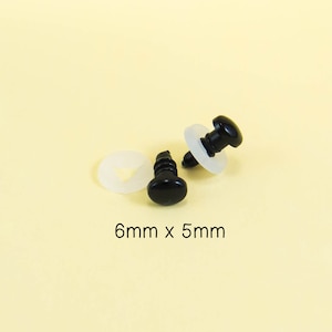May include: Two black plastic safety eyes with white plastic washers. The eyes are 6mm in diameter and 5mm in height.
