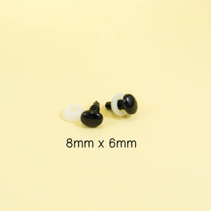 May include: Two black plastic safety eyes with white plastic washers. The eyes are oval shaped and measure 8mm x 6mm.