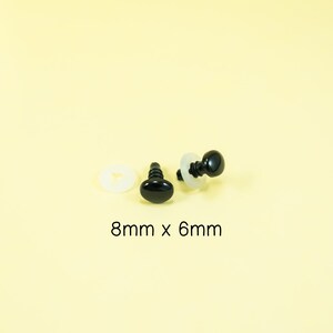 May include: Two black plastic safety eyes with a white washer, measuring 8mm x 6mm.
