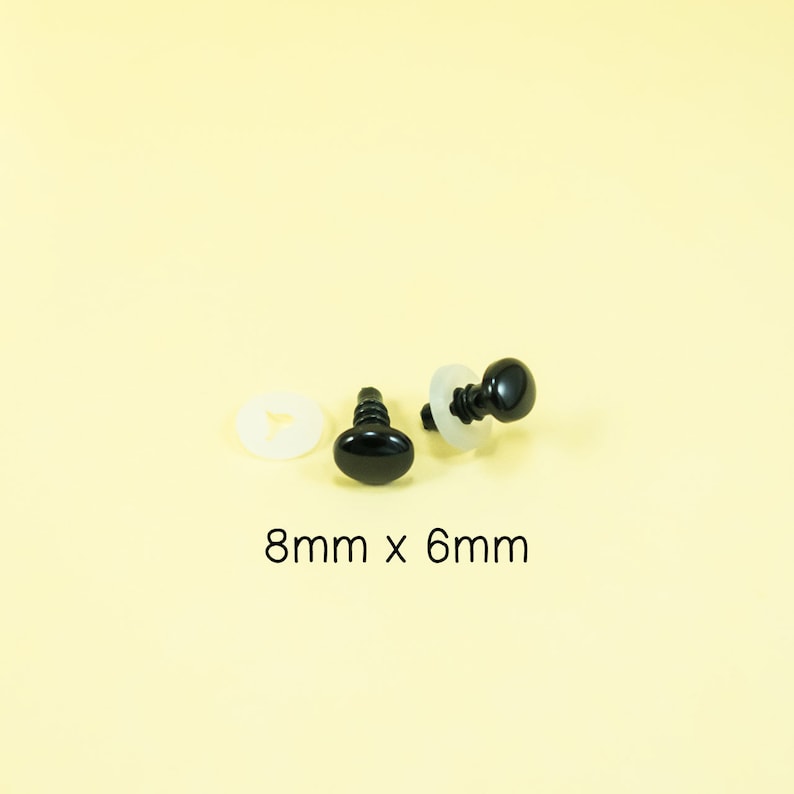 May include: Two black plastic safety eyes with a white washer, measuring 8mm x 6mm.