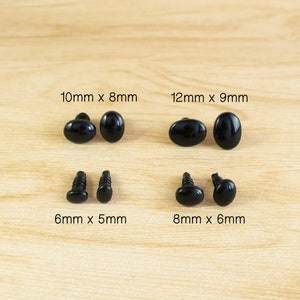 May include: Assortment of black plastic safety eyes for crafts.  The eyes come in four sizes: 6mm x 5mm, 8mm x 6mm, 10mm x 8mm, and 12mm x 9mm.