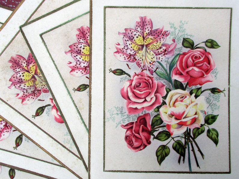 May include: A vintage card with a bouquet of pink, white, and yellow flowers. The flowers are painted in a realistic style and include lilies and roses.