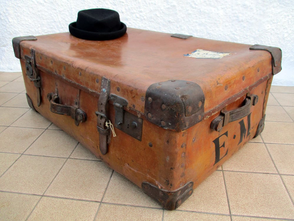 A leather bound 'Osilite' trunk by H.J. Cave & Sons, inscribed for