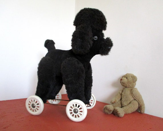 push along dog on wheels