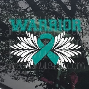 May include: Teal ribbon with white wings and the word "WARRIOR" in teal letters. The ribbon is a symbol of support for those affected by cancer.