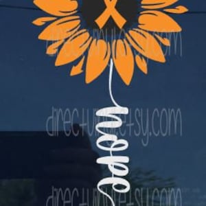 May include: Orange sunflower with an orange ribbon in the center. The stem of the sunflower is a white cursive word "Hope".