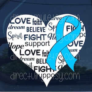 May include: White heart-shaped decal with the words "LOVE", "faith", "dream", "BELIEVE", "Spirit", "FIGHT", "Hope", "support", "LOVE", "dream", "BELIEVE", "FIGHT" printed in black. A light blue ribbon is wrapped around the heart.