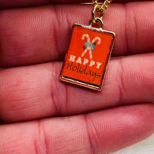 Happy Holidays-bedelketting - gouden kerstsnoephanger