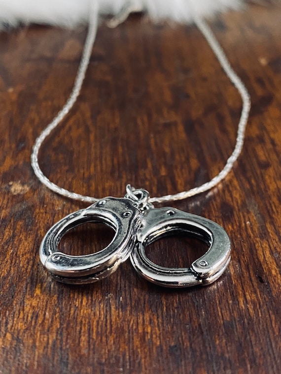 Collana con ciondolo a campanella dorata in argento