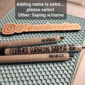 May include: Three silver glitter pens with black lettering. The pens say "HEATHER", "CERTIFIED SURGEON BABYSITTER", and "MICHELLE".