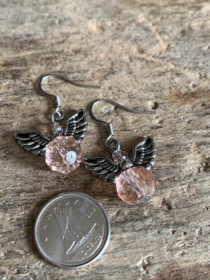 Silver angel earrings and pink resin ball