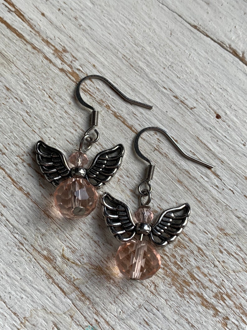 Silver angel earrings and pink resin ball