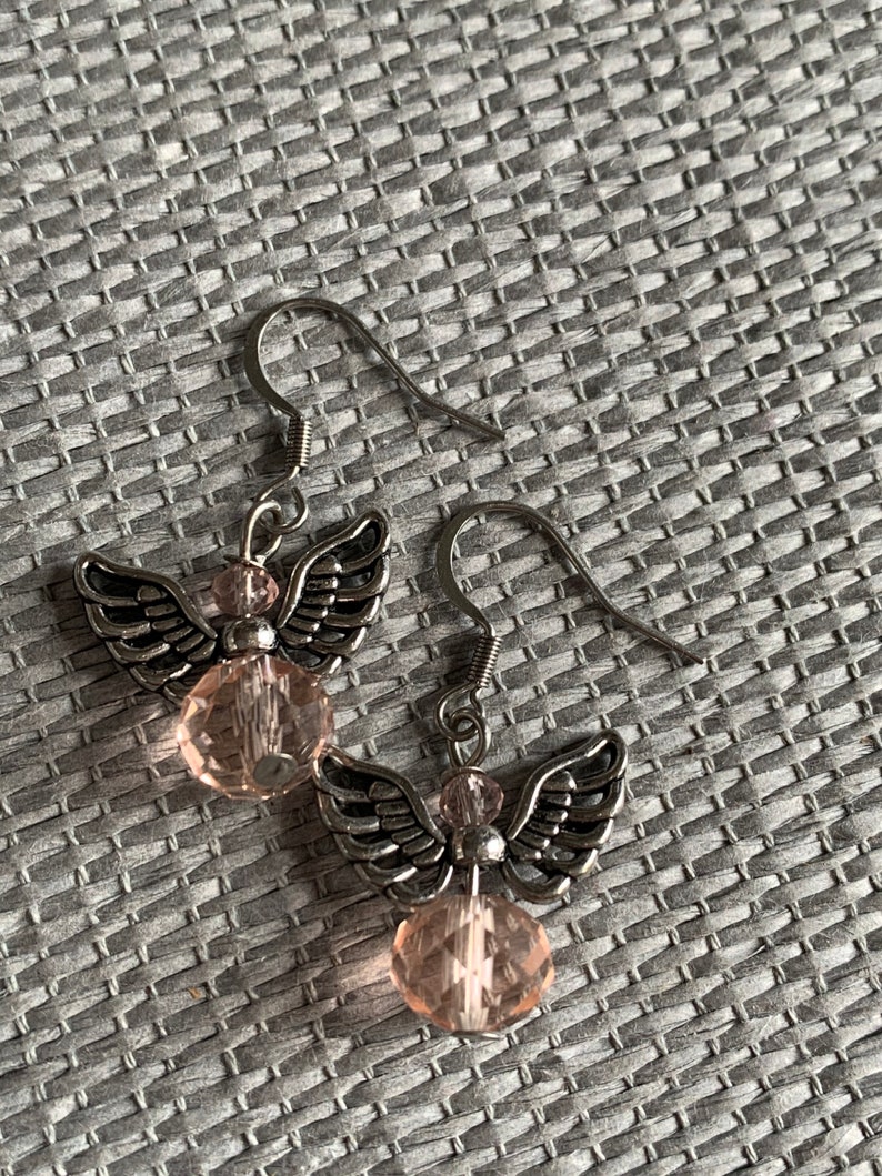 Silver angel earrings and pink resin ball