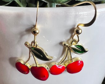 Pair of cherry charm earrings on gold metal alloy hook