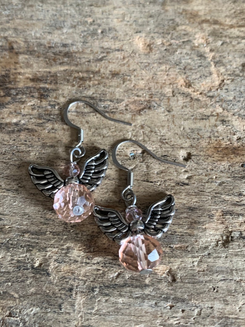 Silver angel earrings and pink resin ball