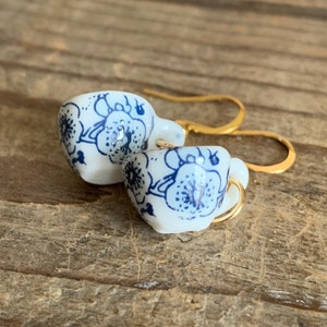 Cup of tea charm earrings with blue lace patterns on gold metal alloy cup of tea hook