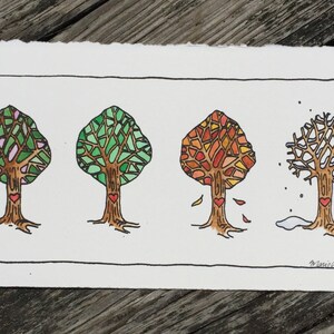 May include: A hand-drawn illustration of four trees representing the four seasons. The trees are stylized with a heart at the base of each trunk. The first tree is in bloom with pink flowers, the second tree is green, the third tree is red and orange, and the fourth tree is bare with snow on the ground.