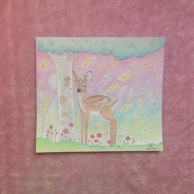 May include: A hand-drawn illustration of a deer with a flower crown standing in a forest with a tree, mushrooms, and a starry sky. The deer is brown and white with a pink nose and a pink flower crown. The background is a gradient of pink, purple, and blue with stars and shooting stars.