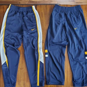 Nike Lot (2) Warm-Up Pants Adult Small Navy Blue with White + Gold Marquette Golden Eagles Colors but doesn&#39;t have to be (No MU logos)