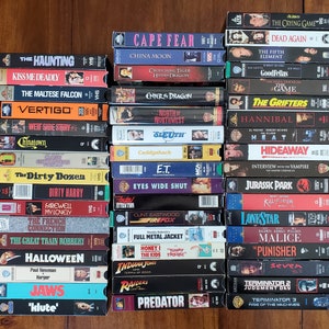 Like New VHS Collection PICK ONE: E.T., Eyes Wide Shut, Halloween, The Haunting, Heat, Jaws, Klute, Jurassic Park, Predator, Seven, Vertigo