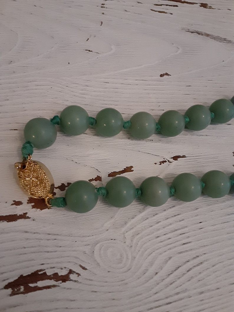 Mid century Jade bead necklace silk string light green
