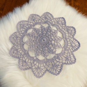 Lilac Gray 9” doily, hand crocheted with 100 percent cotton thread in a smoke free environment.