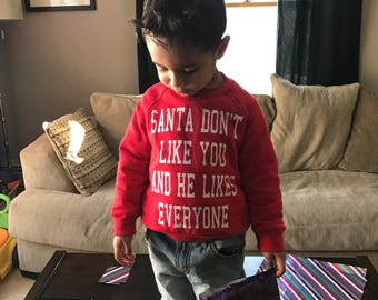 kids sweatshirt santa don't like you and he likes everyone christmas shirt claus funny cute boys girls holiday present gift stocking stuffer