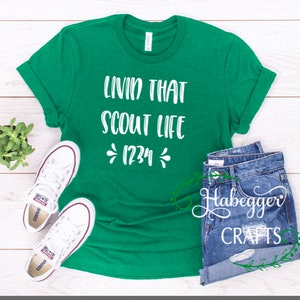 May include: Green t-shirt with white text that reads "Livin that Scout Life *1234*"
