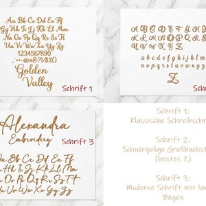 May include: A display of three distinct font styles in gold lettering on a white background. Schrift 1 shows an alphabet with numbers and symbols. Schrift 2 features cursive uppercase and lowercase letters. Schrift 3 displays a script alphabet.
