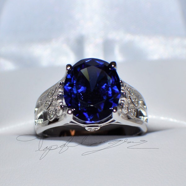 8 Carat AAA Tanzanite an 14  Diamond Gypsy Ring in 14K White Gold Plated Sterling Silver   TGW 8.14 Cts.  Premium Simulated