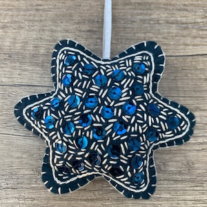 A handmade felt star hanging ornament