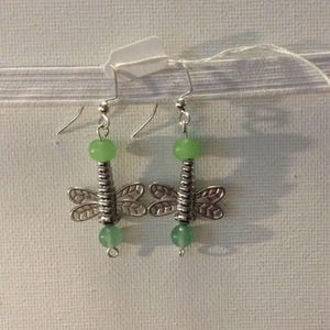 Earrings, glass bead, dragonfly silver accent with light green glass beads