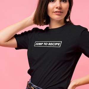 May include: A black t-shirt with white text that says "JUMP TO RECIPE" in a rectangle.
